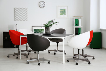 Modern room interior with big table and chairs