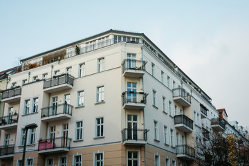 Fototapeta na wymiar white and brown corner building in a street
