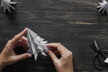 Origami Christmas tree making. Step by step, tutorial with hands