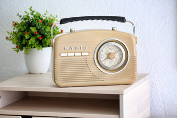 Retro radio on table in room