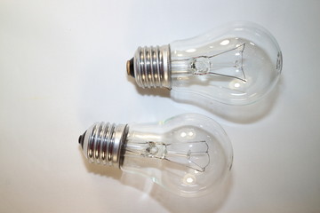 two incandescent lamps close-up on a white background