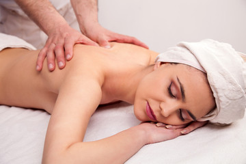 Fototapeta na wymiar Young woman is having a massage