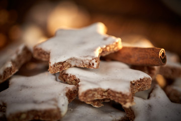 Cinnamon star cookies for christams with pine coins and little red christmas balls