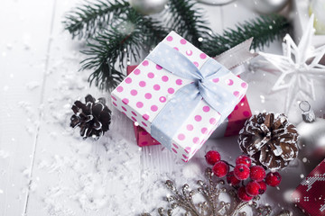 Christmas background with gift boxs, christmas tree, mittens and decorations