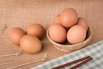 Set Eggs in a basket on  gunny (sackcloth)  background