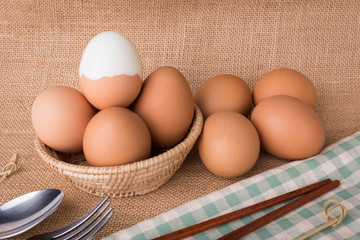 Set Eggs in a basket on  gunny (sackcloth)  background