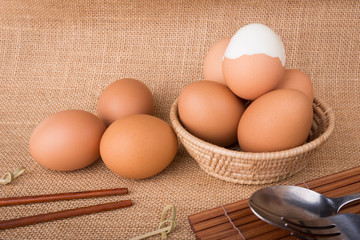 Set Eggs in a basket on  gunny (sackcloth)  background