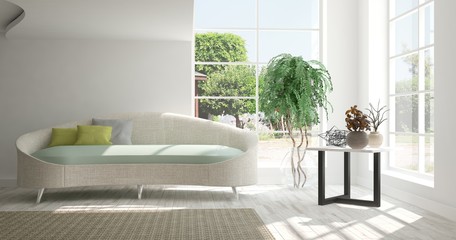 Idea of white room with sofa and summer landscape in window. Scandinavian interior design. 3D illustration