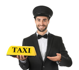 Handsome male driver with taxi roof light on white background