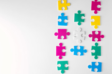 Puzzle pieces on white background as symbol of autism