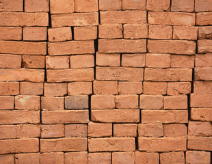 Stack of new red bricks background