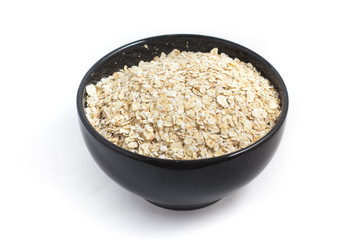 Oats flakes in a black bowl