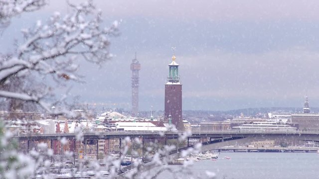 Slow motion clip of snowfall in Stockholm on a wintry day at dusk.