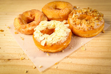 Donuts on wooden background