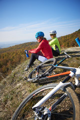 Two female cyclist enjoying the beautiful scenery while out mountain biking.