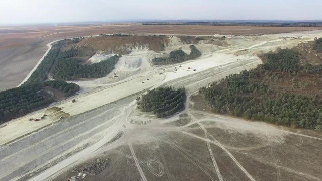 AERIAL: Limestone quarry / AERIAL: Flying along limestone quarry  