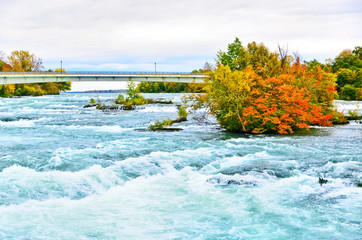 View of Niagara River at the upstream of Niagara Falls from American side in autumn.