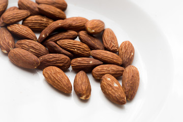 Closeup of almonds, isolated on the white background