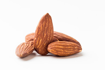 Closeup of almonds, isolated on the white background