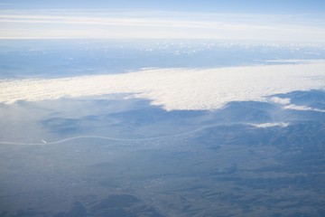 Fototapeta na wymiar Over the clouds. Photo from plane.