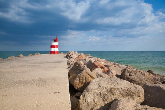 Lighthouse on the Tavira Island before storm,Portugal