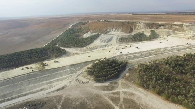 AERIAL: Limestone quarry / AERIAL: Flying along limestone quarry  