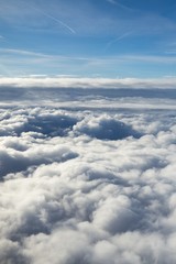 Obraz na płótnie Canvas Over the clouds. Photo from plane.