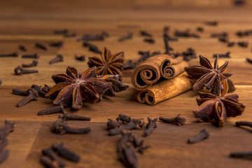 Dried orange slices on a wooden background arranged with cinnamon and anis