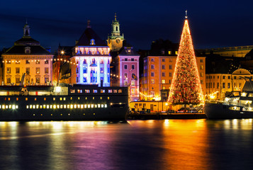 Fototapeta na wymiar Stockholm city with illuminated christmas tree and festive decorations.