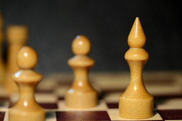 Chess figures on a chessboard close up