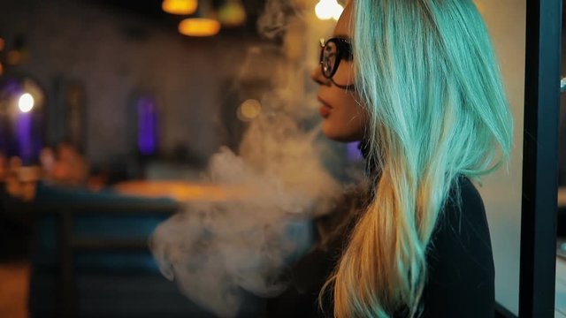 Woman smoking a hookah