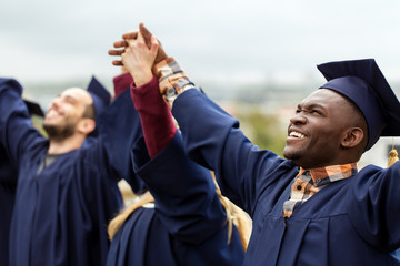 happy students celebrating graduation