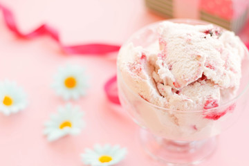 ice cream in a Cup next to the marshmallows, flowers, pink sweets