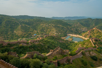 Indian travel famous tourist landmark, beautiful landscape of Amber fort walls and Maota lake, Rajasthan, India