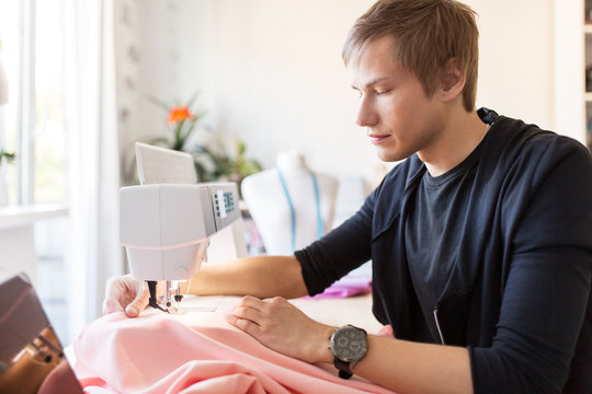 fashion designer with sewing machine working