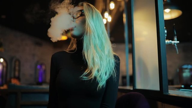 Woman smoking hookah vapour