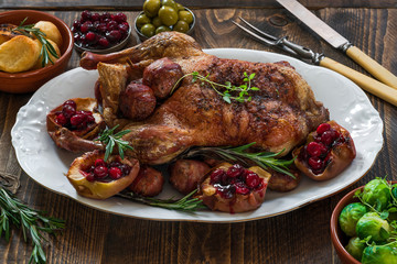 Festive roast duck on wooden table - high angle view