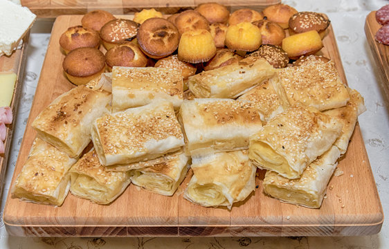 Traditional Serbian cheese pie gibanica and muffins