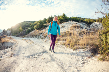 A girl with a backpack.