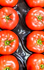 Macro closeup of beefsteak tomatoes in packaging