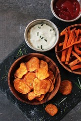 Homemade Sweet potato chips and fries served with dips / Thanksgiving food