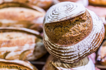 Closeup of circular sourdough baked bread loaf in bakery