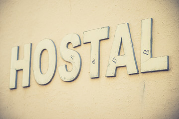 The hotel word placed on a building