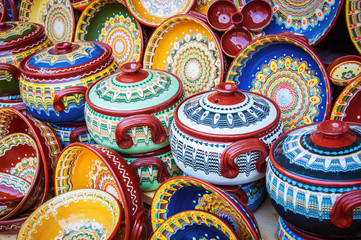 Colorful ceramic dishes. Traditional bugarian patterns. - obrazy, fototapety, plakaty