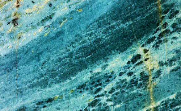 Jasper mineral stone texture pattern macro view. Aggregate of microgranular quartz and chalcedony, green color gemstone background.