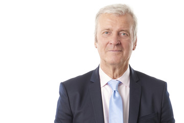 Senior professional man standing against white background 