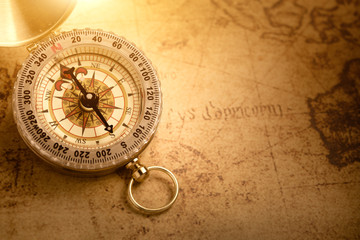 Fototapeta na wymiar Old vintage compass with vintage map