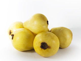 Several guava fruits on a white background