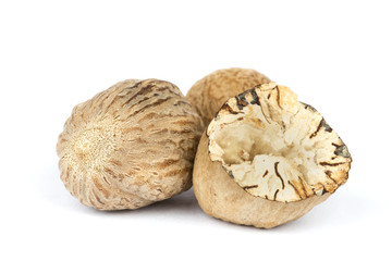 Nutmeg on white background close up.
