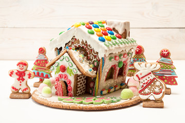 Gingerbread house. Christmas holiday sweets. European Christmas holiday traditions. Christmas gingerbread house and holiday decorations.